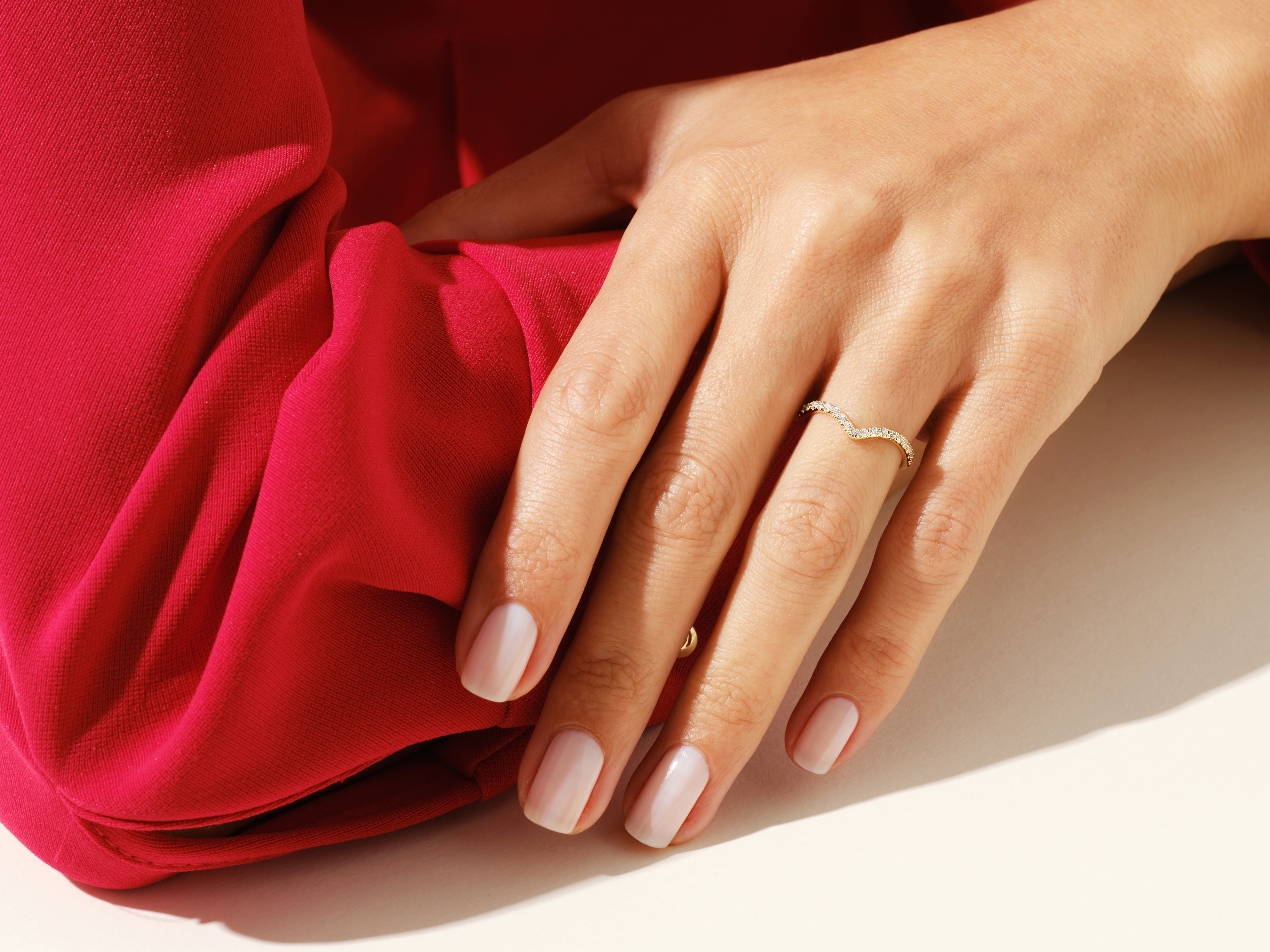 Diamond chevron ring on hand, elegant jewelry for women