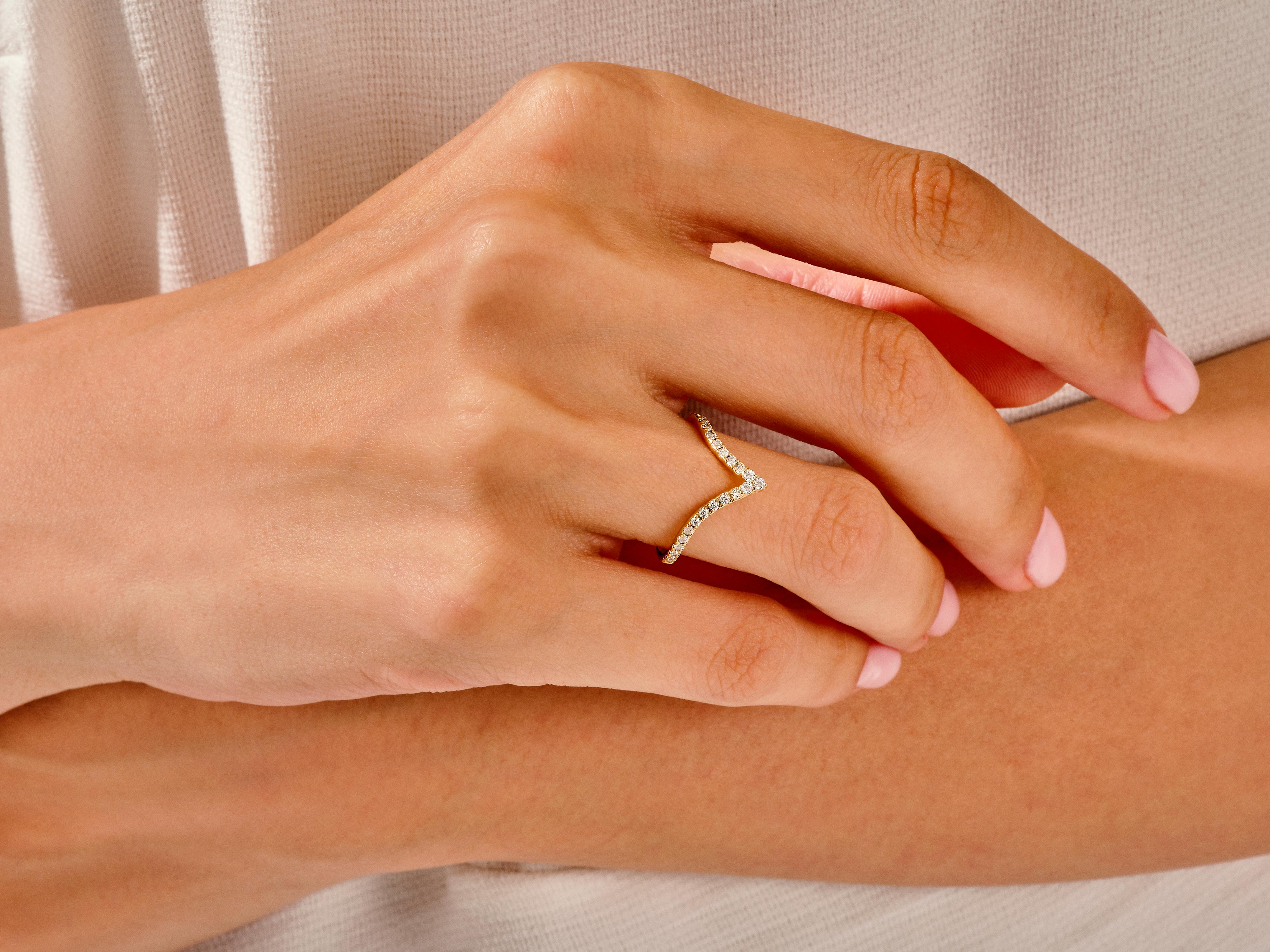 Diamond chevron ring on hand, fine jewelry