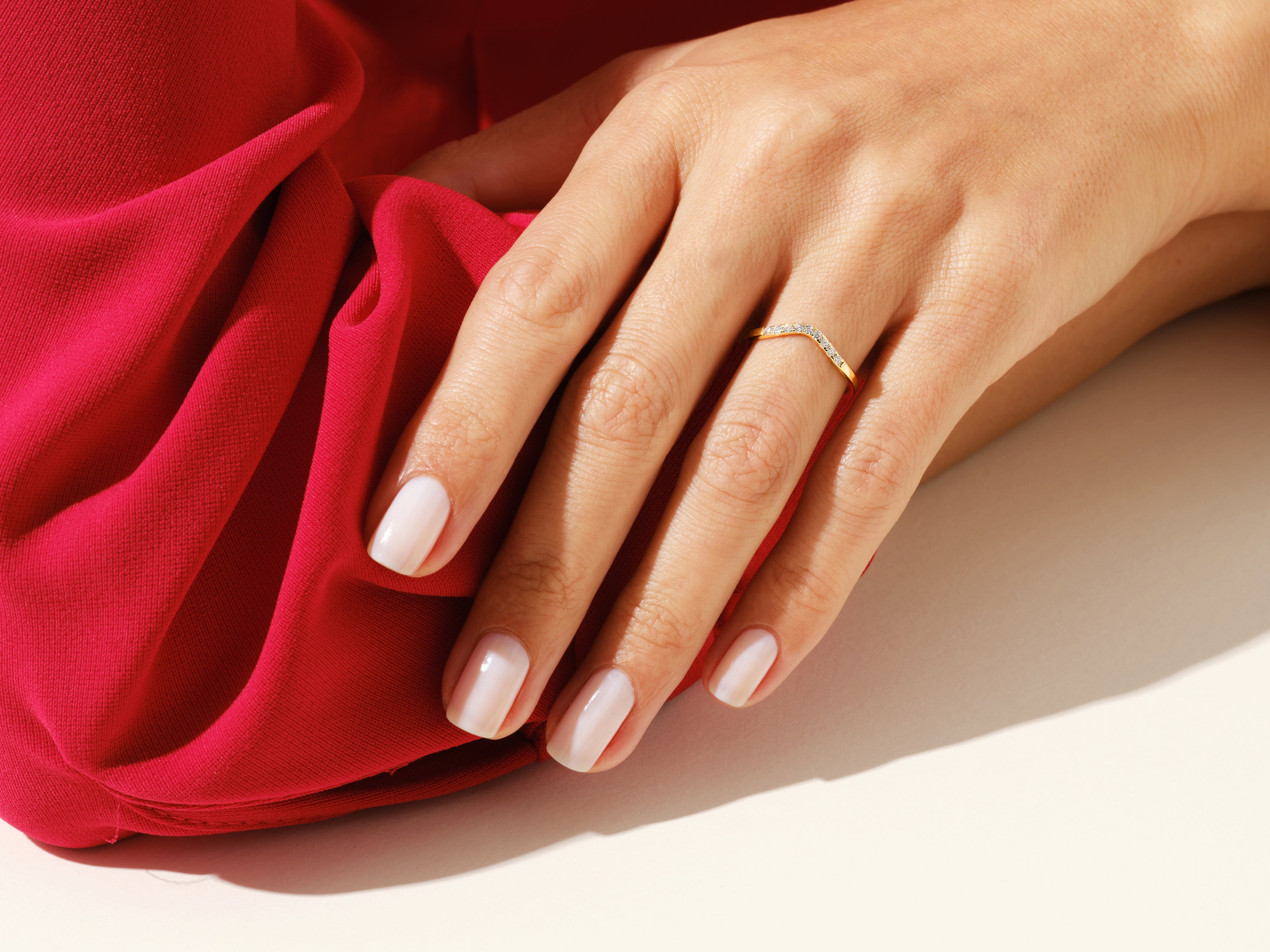 Diamond chevron ring on hand, elegant jewelry for women