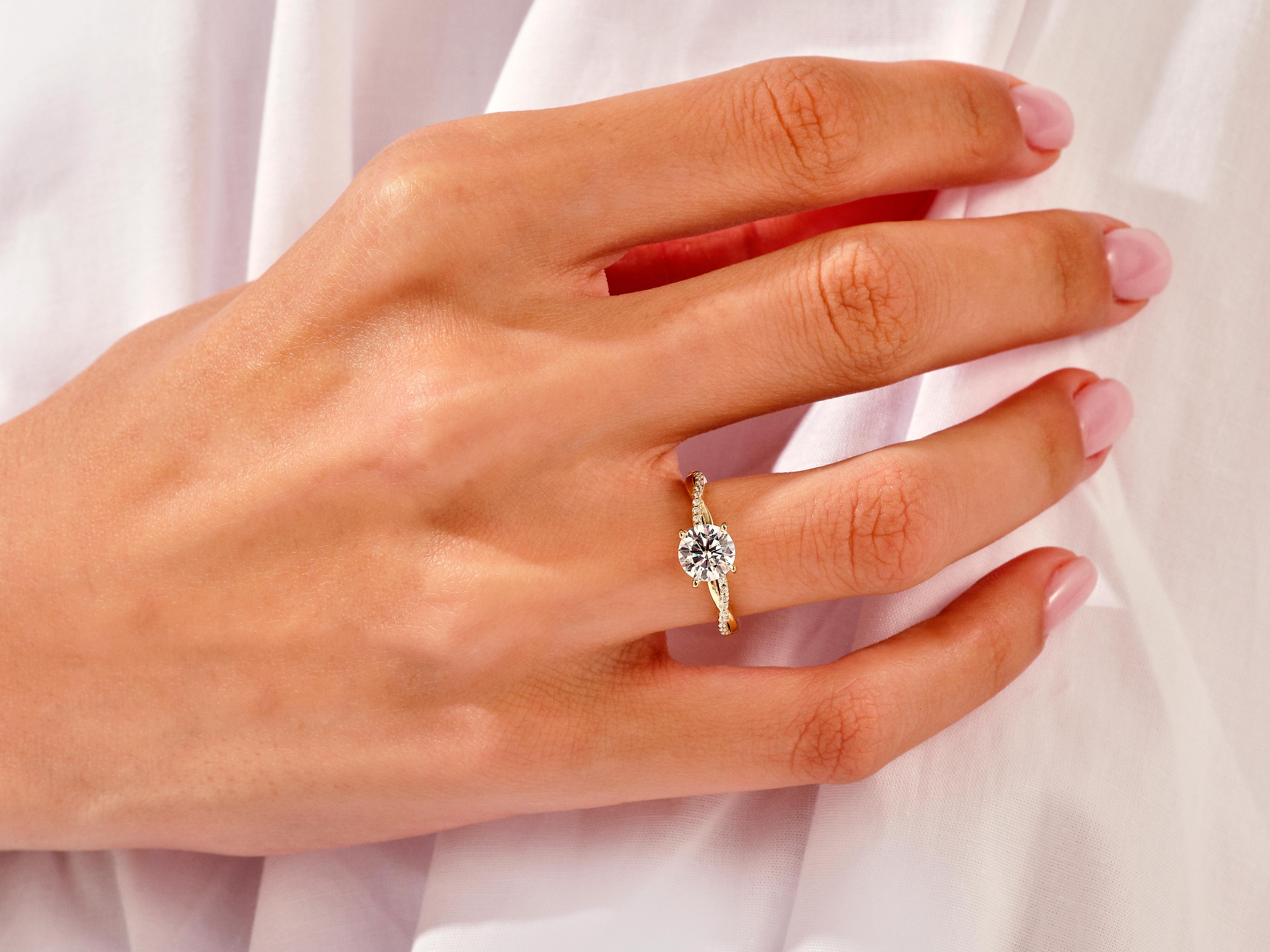 Diamond engagement ring on a woman's hand, fine jewelry