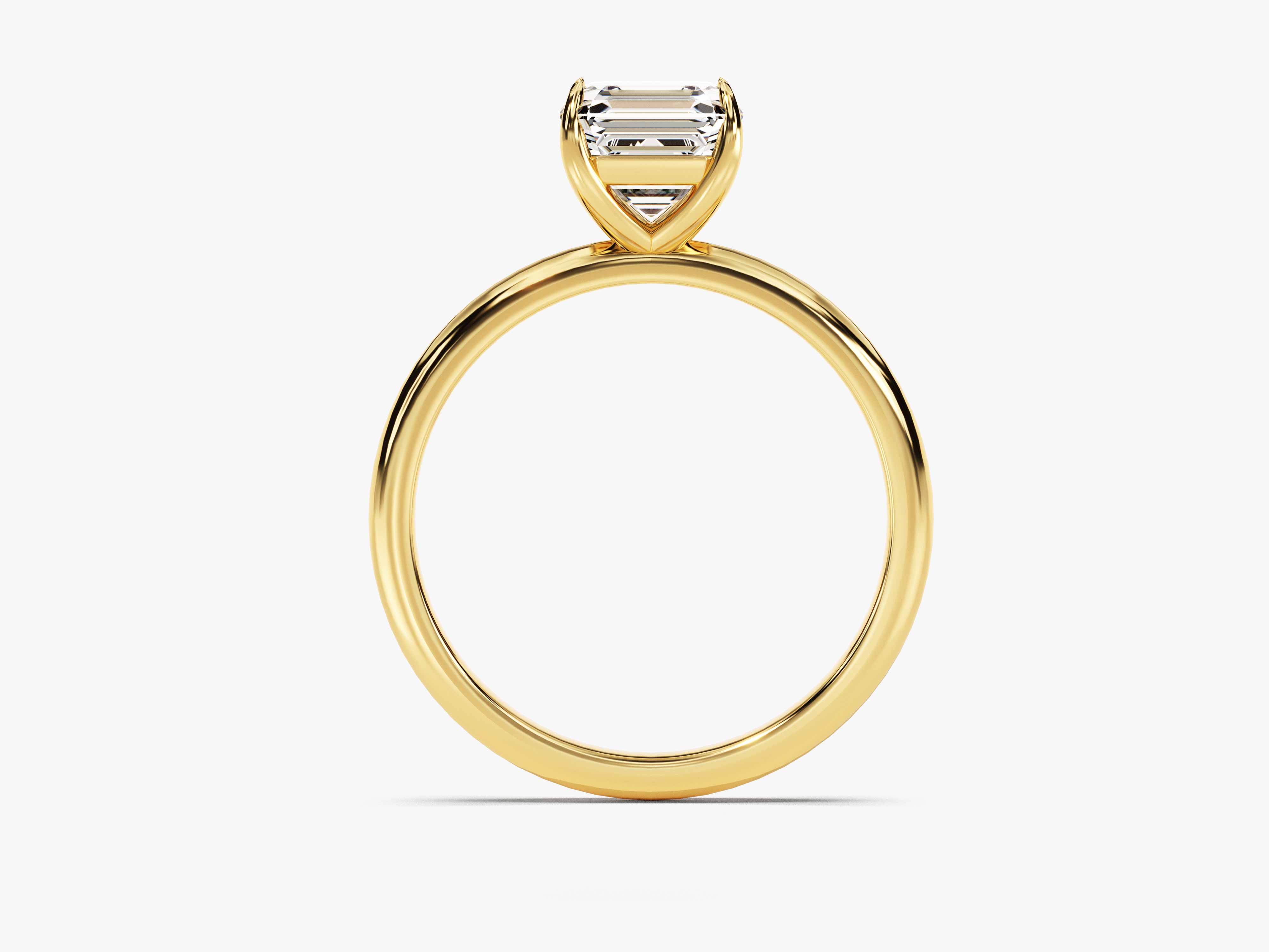 Emerald cut diamond ring in yellow gold setting