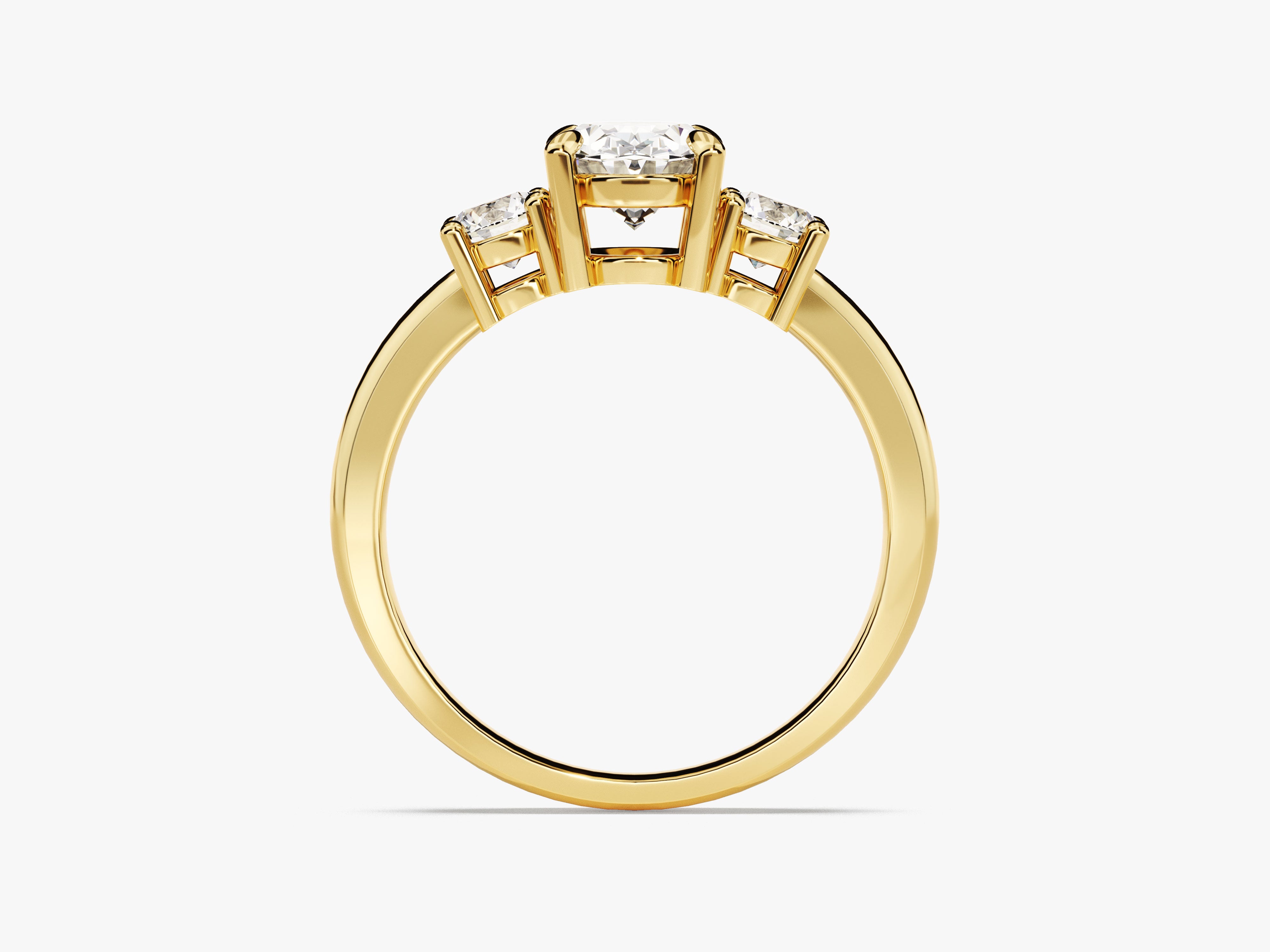 Three-stone diamond engagement ring in yellow gold