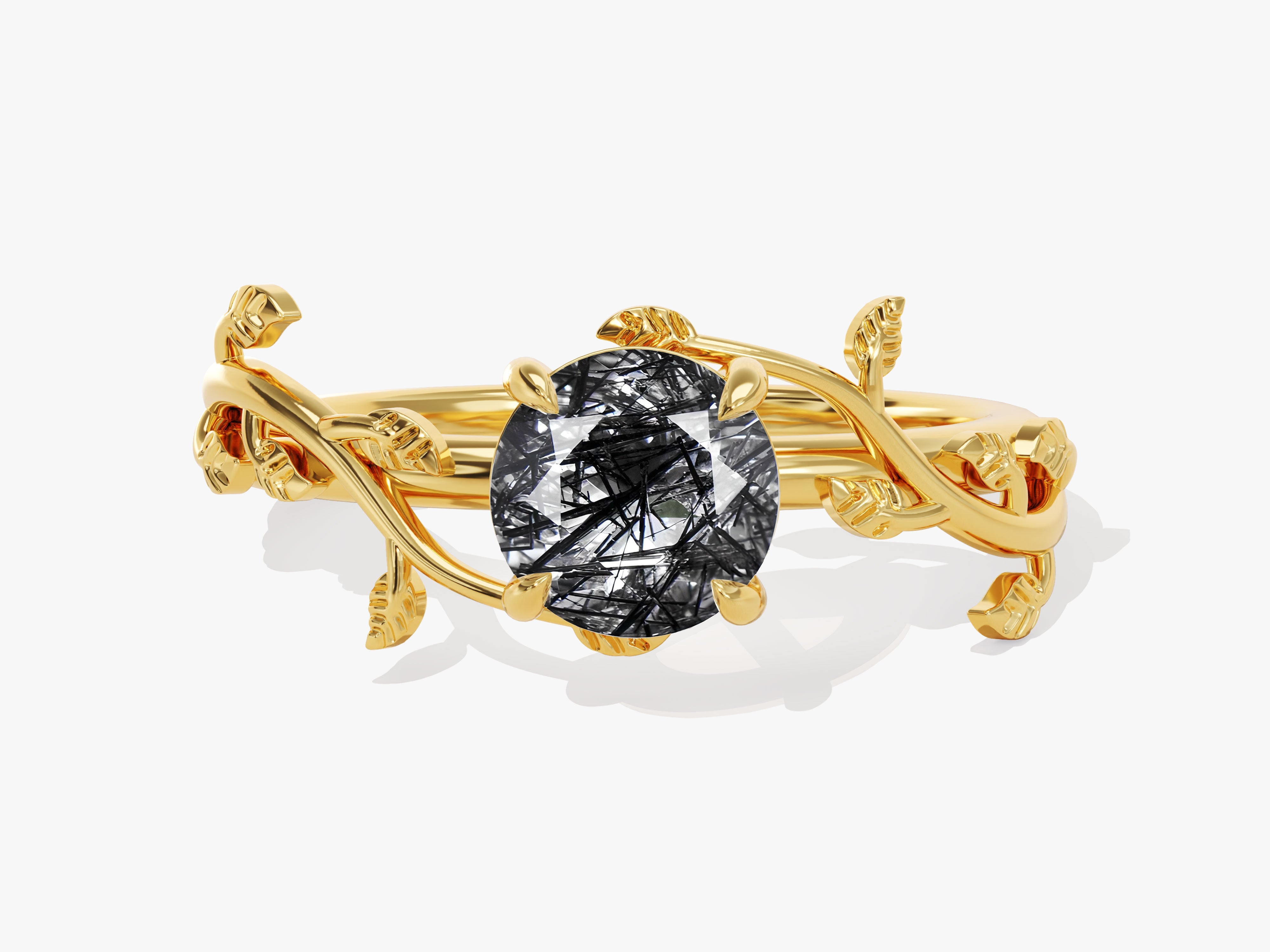 Gold ring with oval rutilated quartz and leaf design