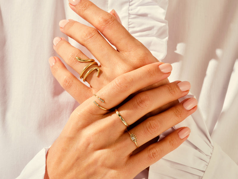Yellow, White, Rose, 14k gold, 18k gold, Different Designed Fashion Rings on a Woman's Fingers