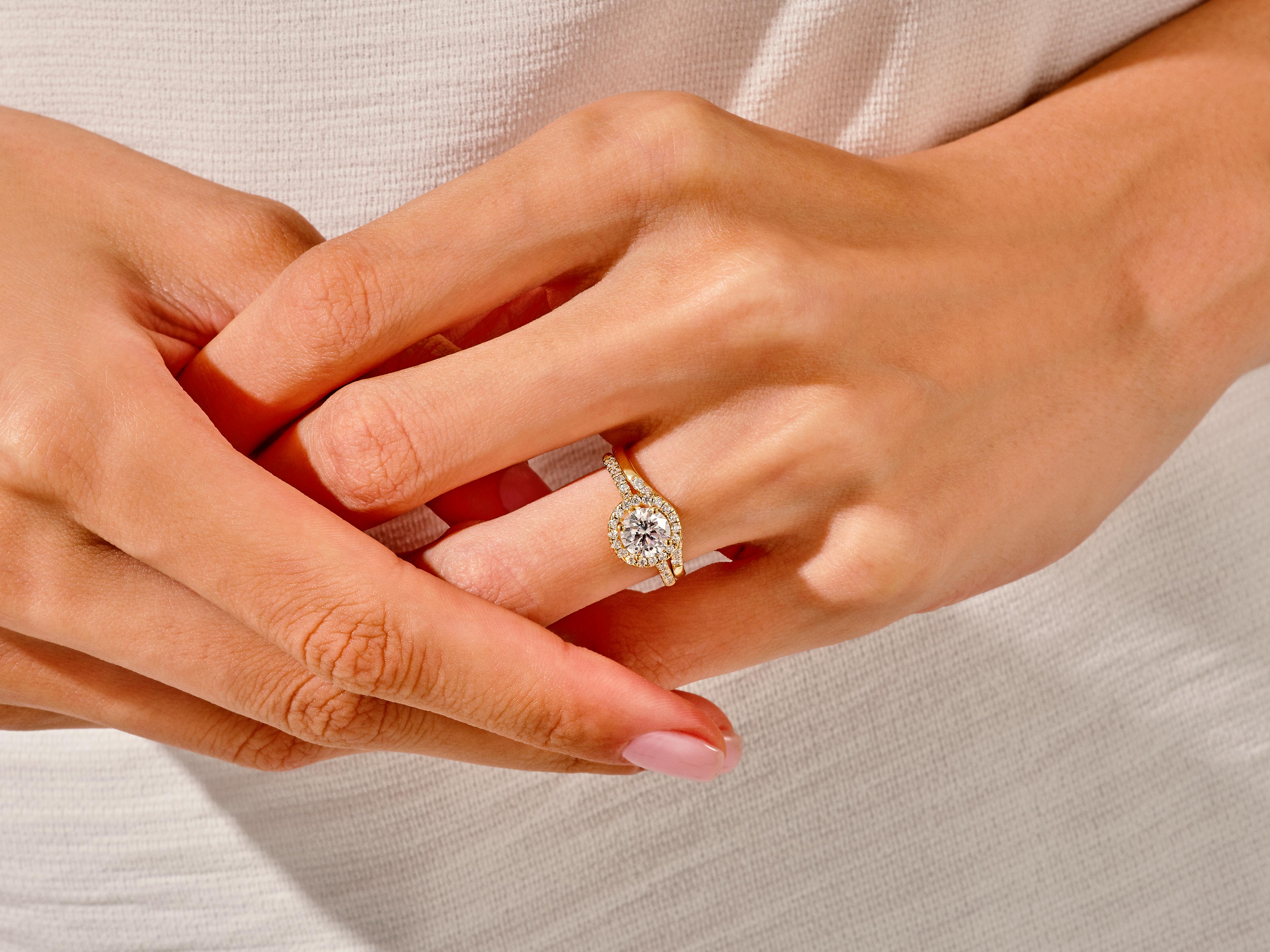 Diamond engagement ring on a hand, jewelry photography