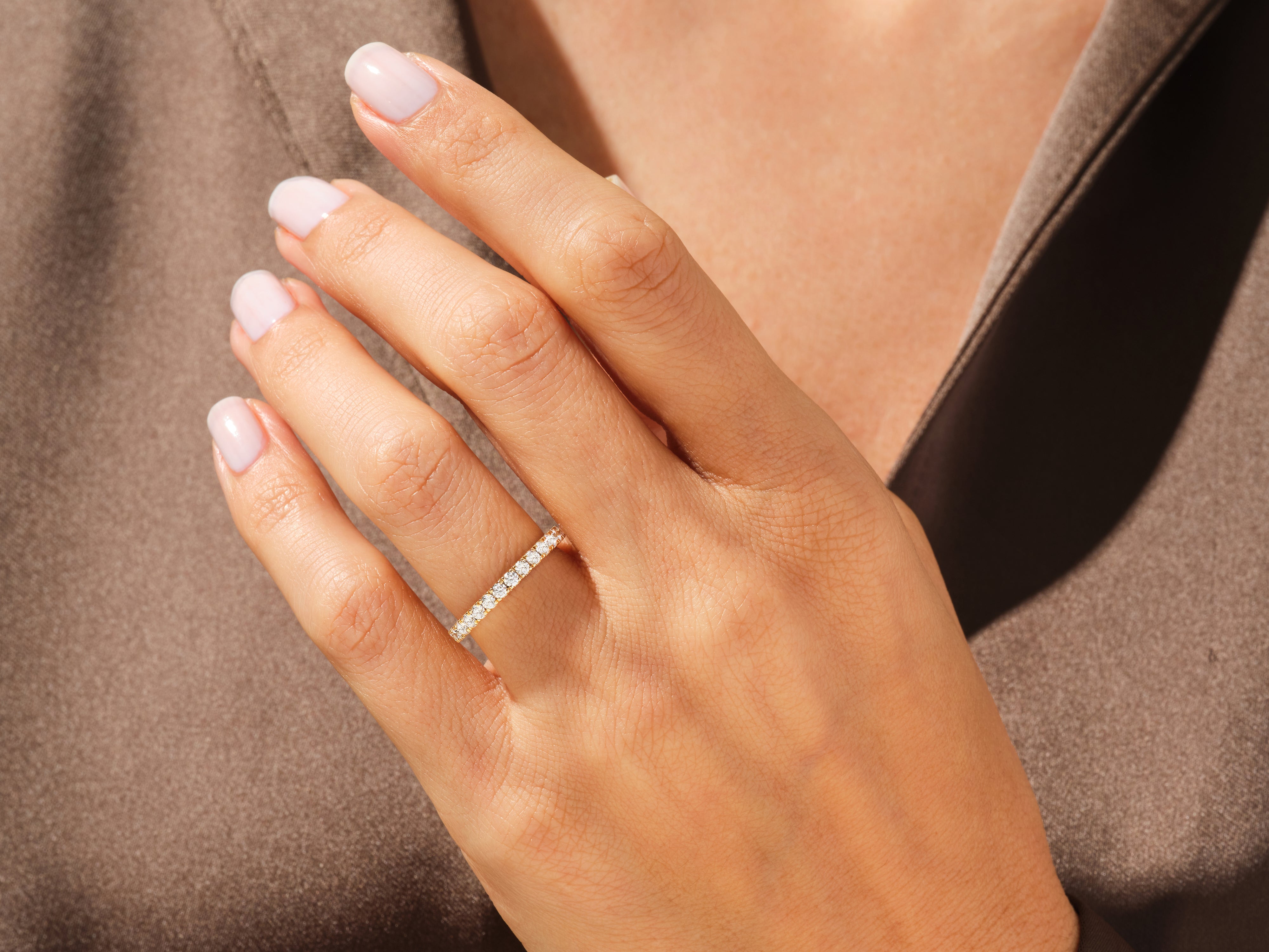 Diamond eternity ring on a woman's hand, luxury jewelry