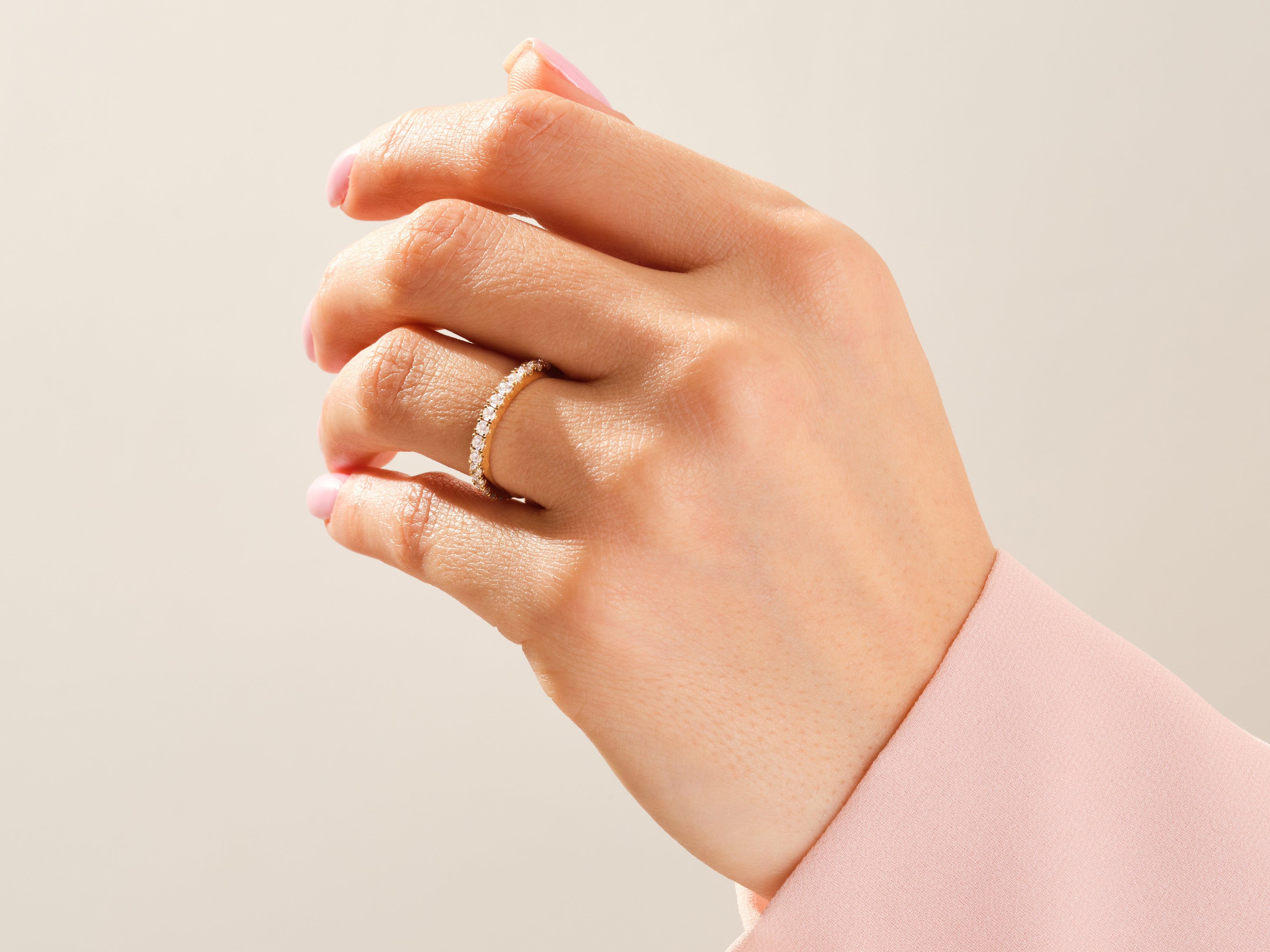 Diamond eternity ring on a woman's hand