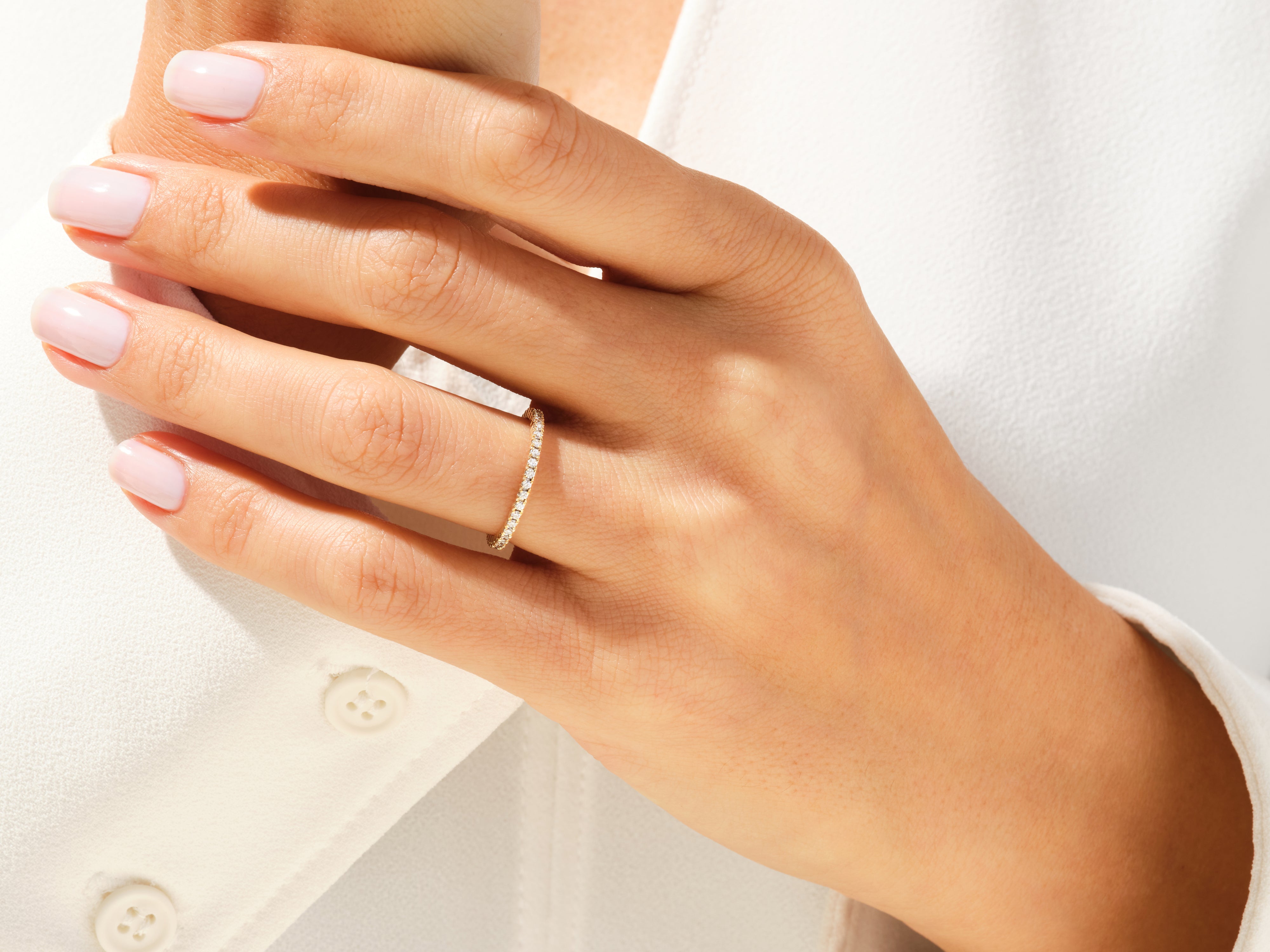 Diamond eternity ring on a woman's hand