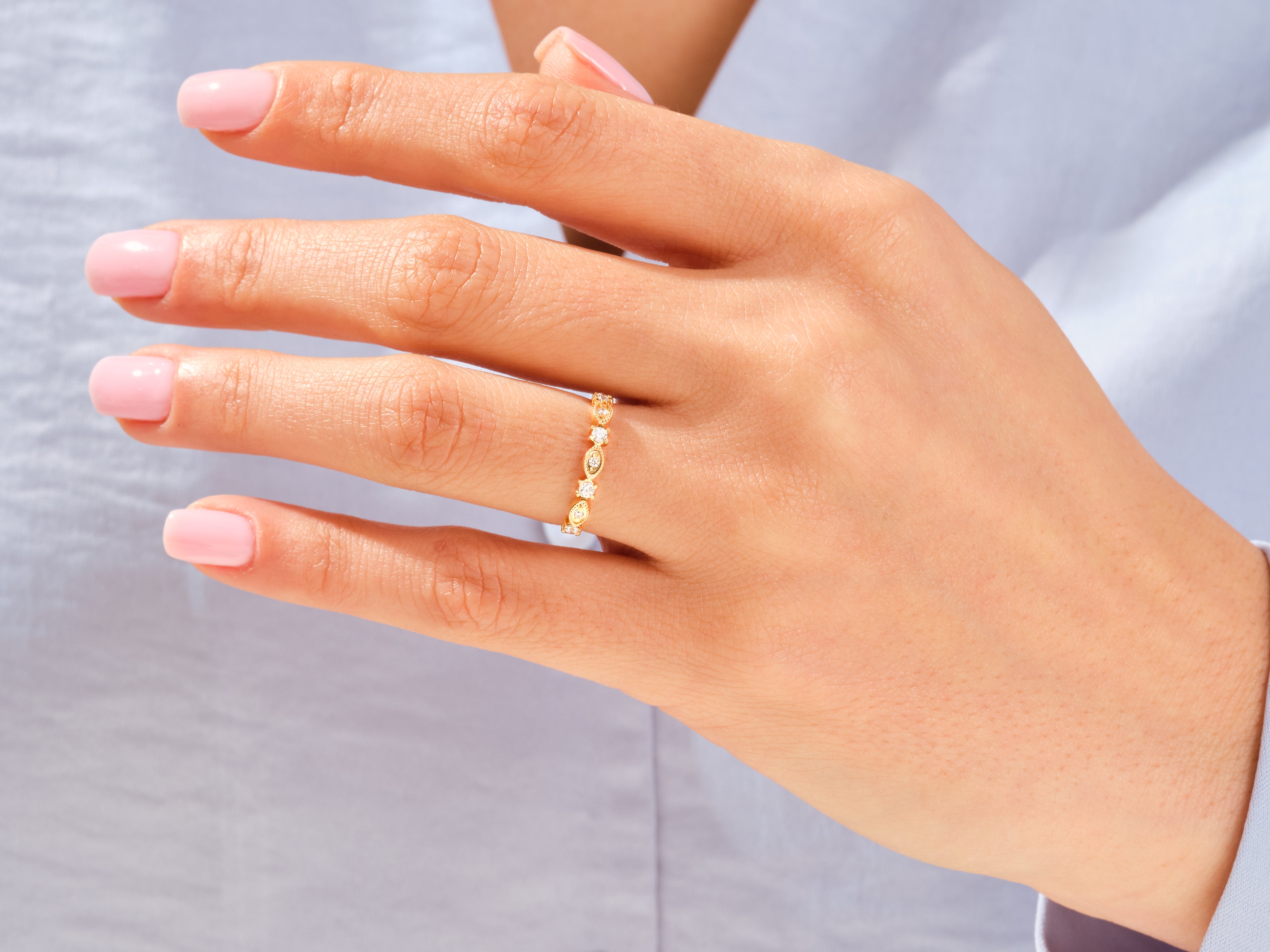 Gold diamond ring on a woman's hand, jewelry