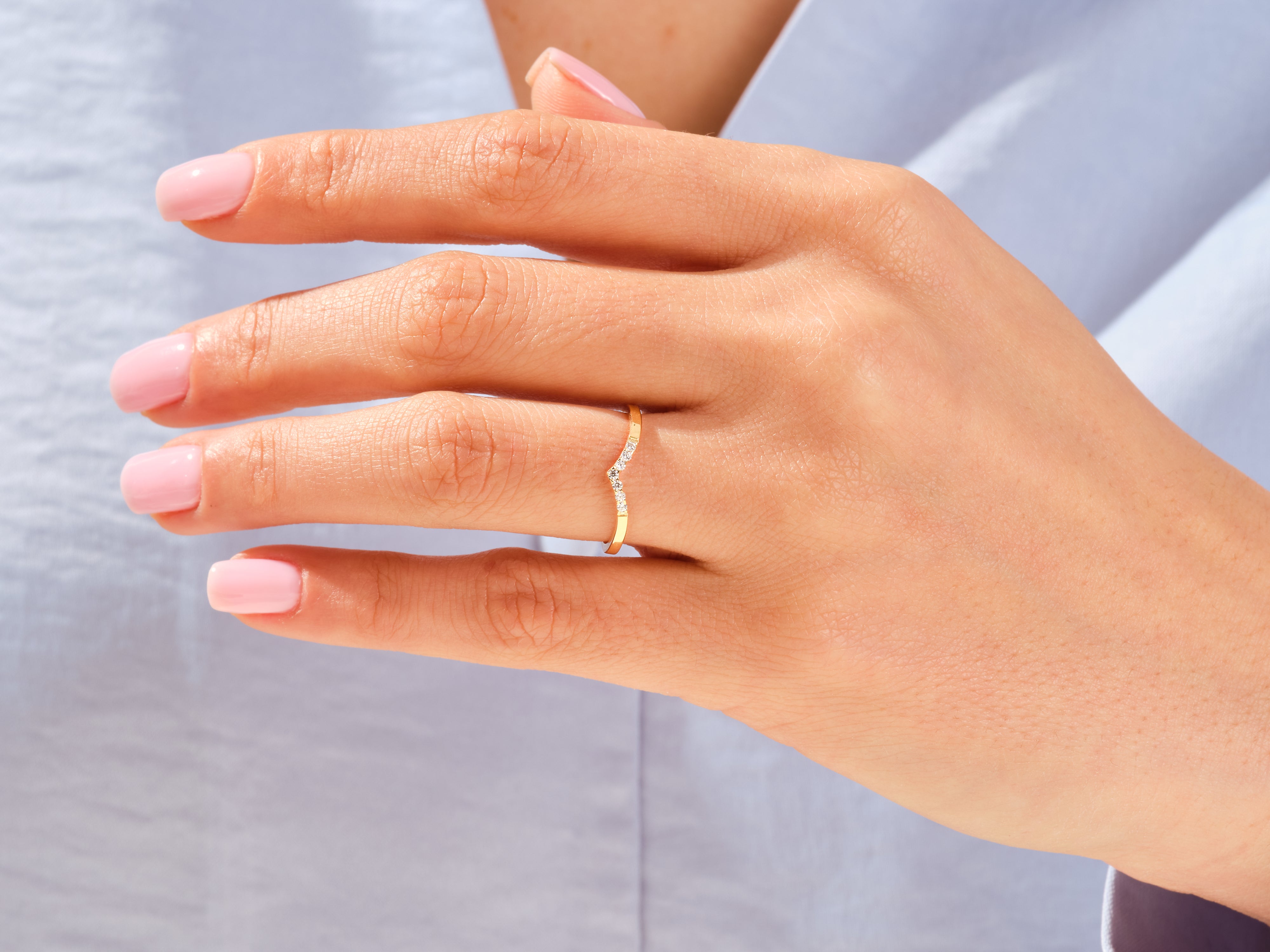 Diamond curved ring on a woman's hand, jewelry
