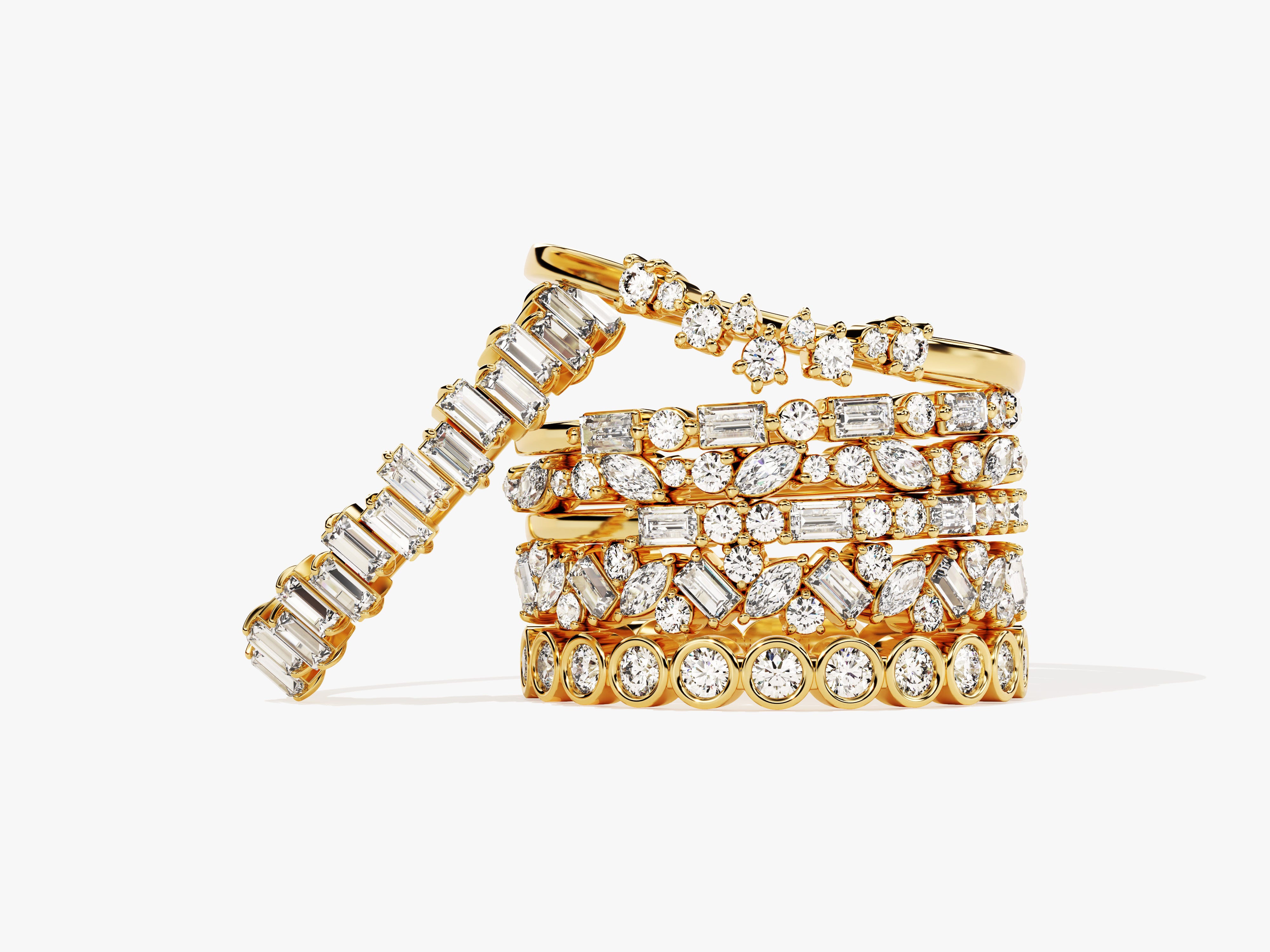 Stack of gold diamond rings with various cuts